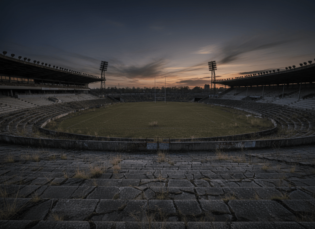An empty, abandoned rugby stadium at dusk, symbolising the decline of professional rugby clubs
